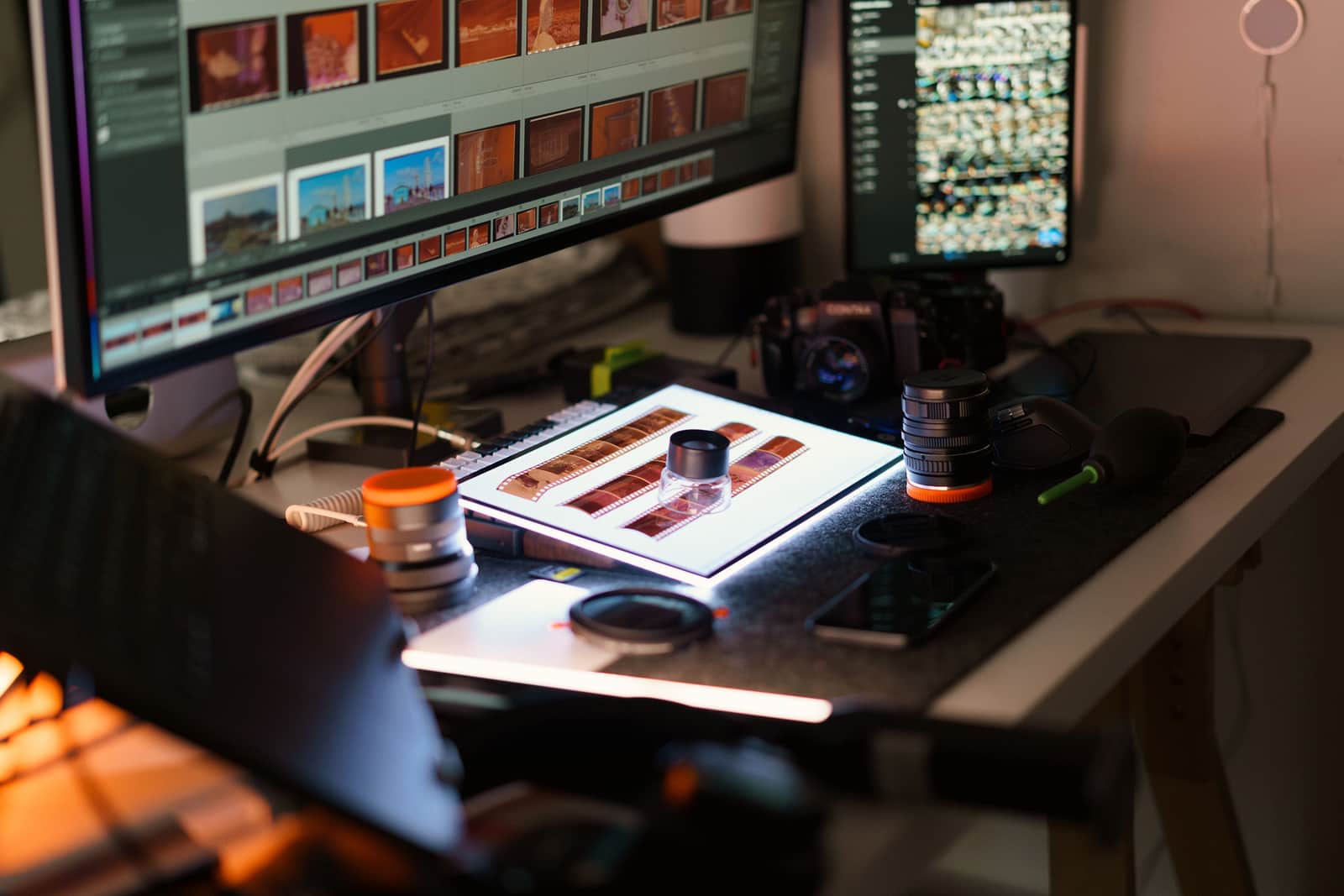 A workspace laid out with gear and reference material